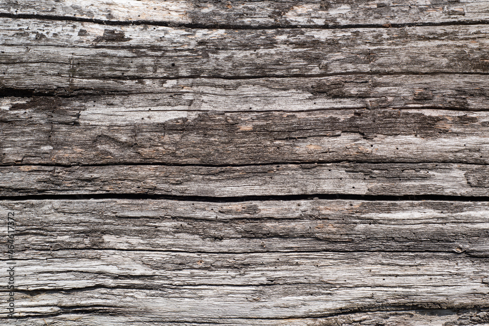 A beautiful horizontal surface made of old weathered gray planks. Vintage rustic background. A beautiful horizontal surface made of old weathered gray planks. Vintage rustic background.