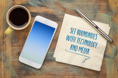 set boundaries with technology and media - handwriting on napkin with coffee and phone, lifestyle, self care, digital minimalism and personal development concept photo