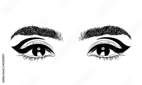 Woman's eyes with perfectly shaped eyebrows and full lashes with graphic eyeliner