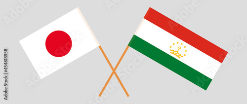 Crossed flags of Japan and Tajikistan. Official colors. Correct proportion