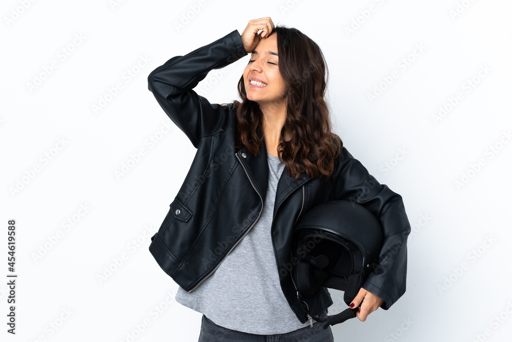 Young woman holding a motorcycle helmet over isolated white background smiling a lot Young woman holding a motorcycle helmet over isolated white background smiling a lot