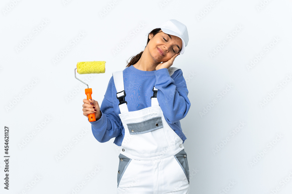 Painter woman over isolated white background making sleep gesture in dorable expression Painter woman over isolated white background making sleep gesture in dorable expression