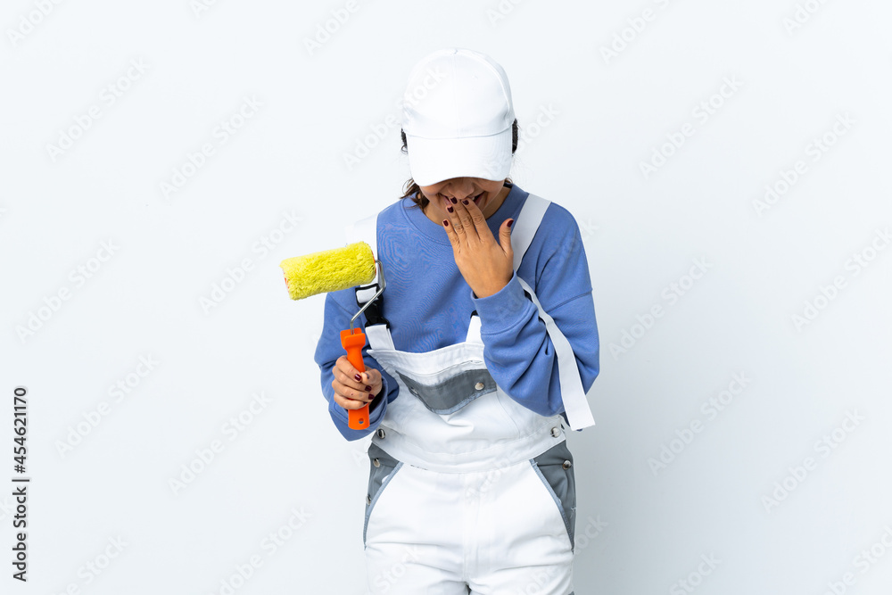Painter woman over isolated white background happy and smiling covering mouth with hands