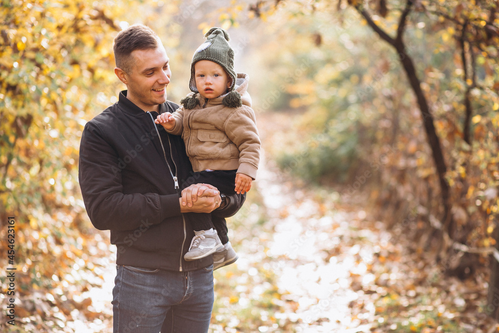 Father holding his son in park Father holding his son in park