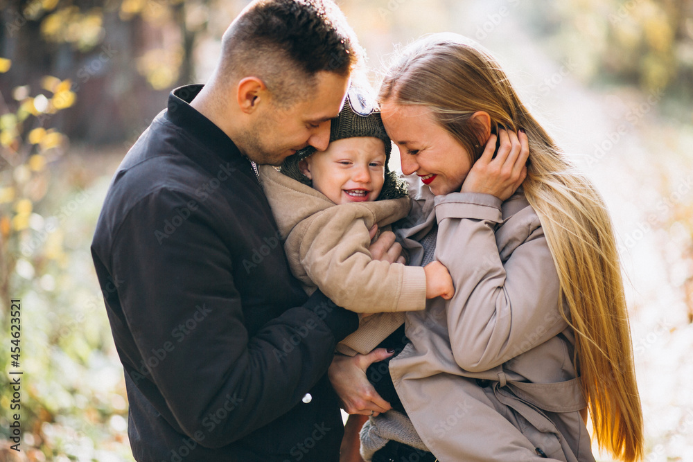 Family with a little son in autumn park Family with a little son in autumn park
