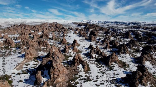Aerial view of ignimbrite rock field with snow. In the Andes mountain range. photo