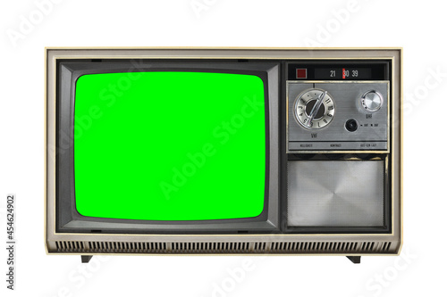 Old vintage 1970s TV with green screen for adding video isolated on white background.Vintage TVs 1960s 1970s 1980s 1990s 2000s.  photo