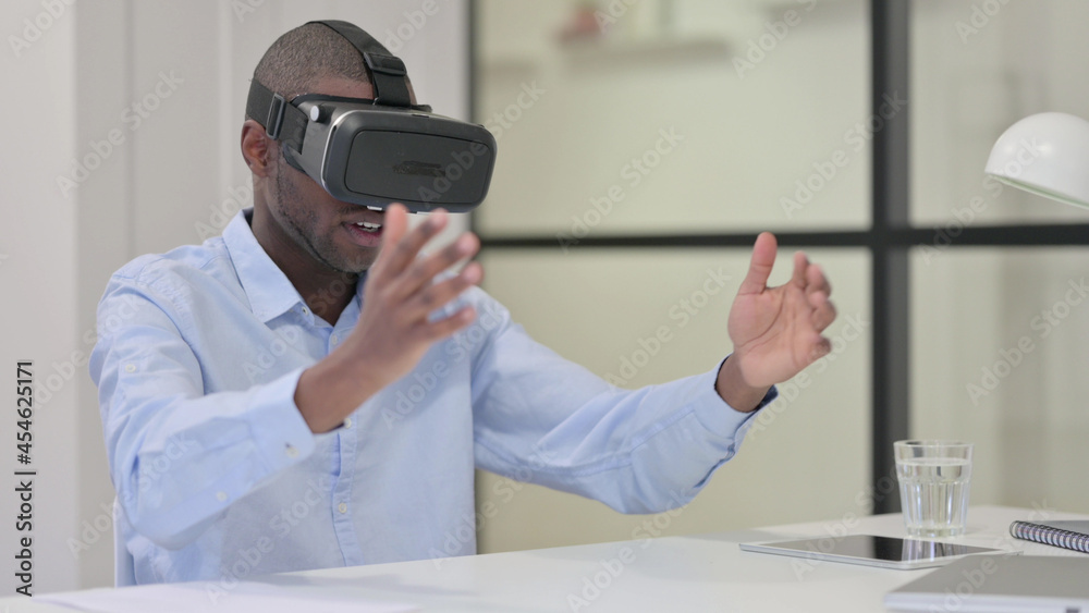 African Man using VR Glasses for Virtual Reality Experience African Man using VR Glasses for Virtual Reality Experience