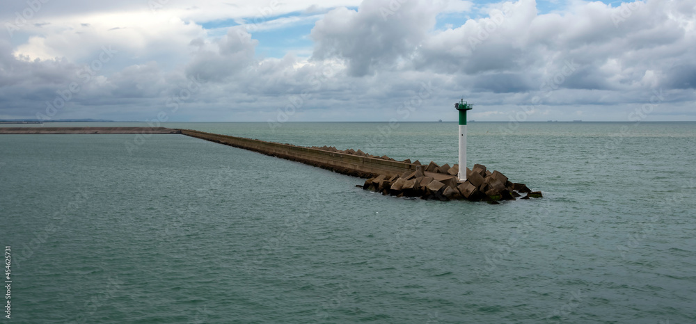 Breakwater with lighthouse on French coast - Calais, France