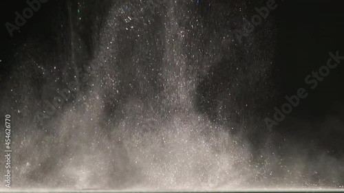 The explosive wave of shimmering particles. slow motion