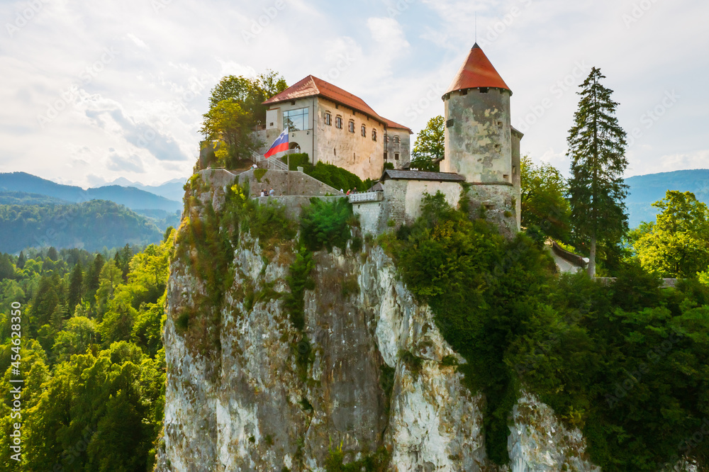 Aerial view of mediaeval Bled castle on the cliff of the mountain in Slovenia