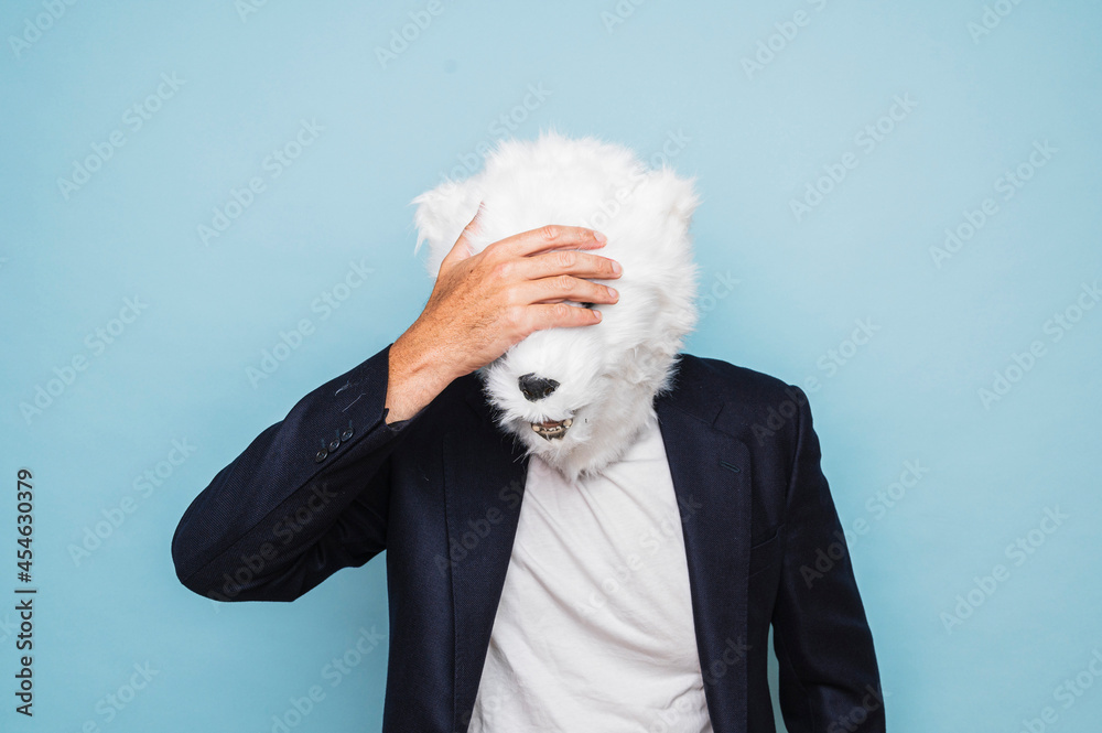 Man with polar bear mask making gesture of concern. Man with polar bear mask making gesture of concern.