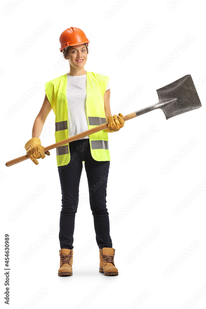 Full length portrait of a female worker holding a shovel Full length portrait of a female worker holding a shovel