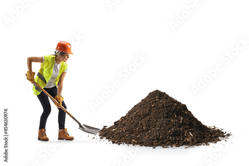 Photography Female construction worker digging with a shovel