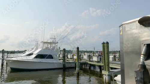 Move toward boat dock with fuel pump in foreground