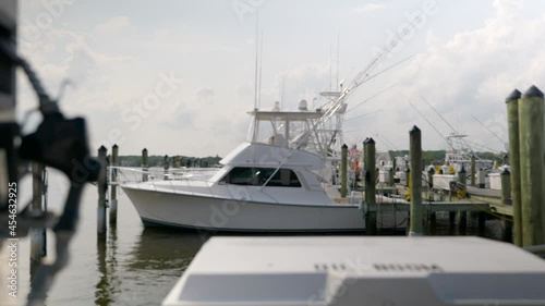Slow pan boat dock fuel pump with boats in background