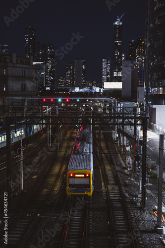 City Train Cutting Through Inner City High-Rise Buildings 