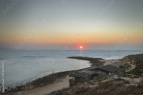 Long Exposure of Sunset at the sea in Praia do Farol Vila Nova de Milfontes