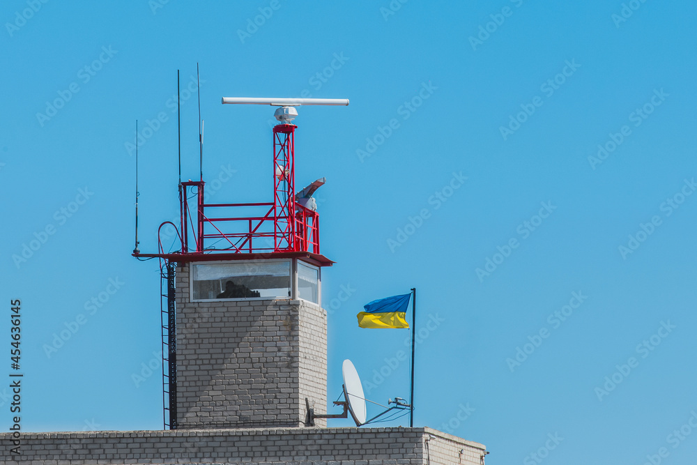 Safety and security post or tower pier sea symbol and landmark against the blue sky Safety and security post or tower pier sea symbol and landmark against the blue sky