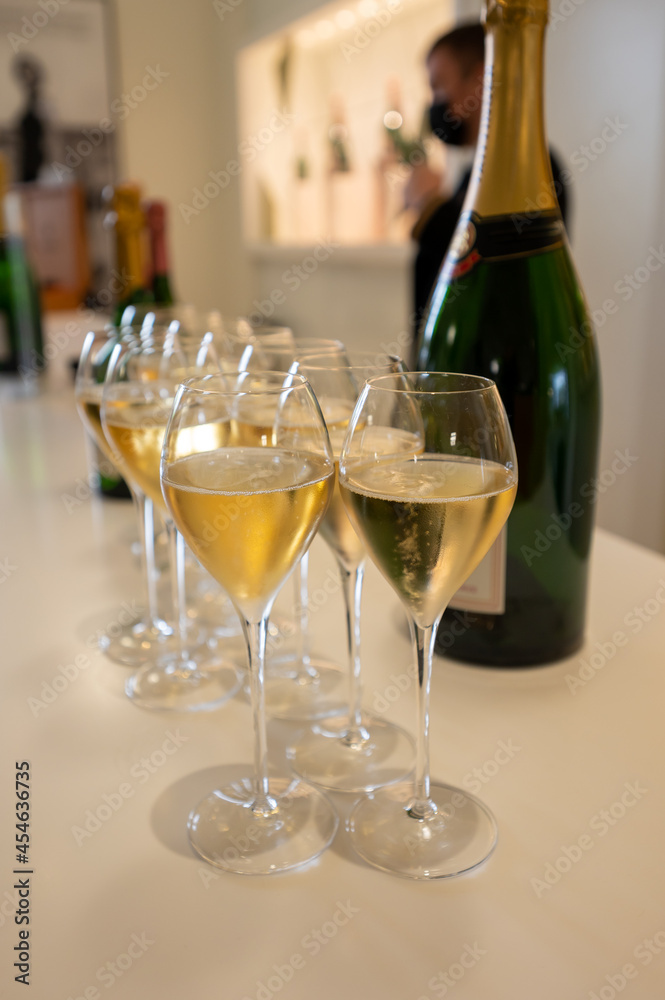 Tasting of brut champagne sparkling wine during visit caves in champagne house in Reims, France Tasting of brut champagne sparkling wine during visit caves in champagne house in Reims, France