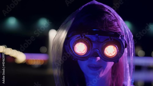 Sci-fi cyborg girl in a futuristic city photo