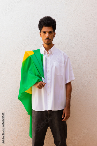 Business or Worker Holding a Brazil Flag Isolated On White. Flag and Independence Day Concept Image.
