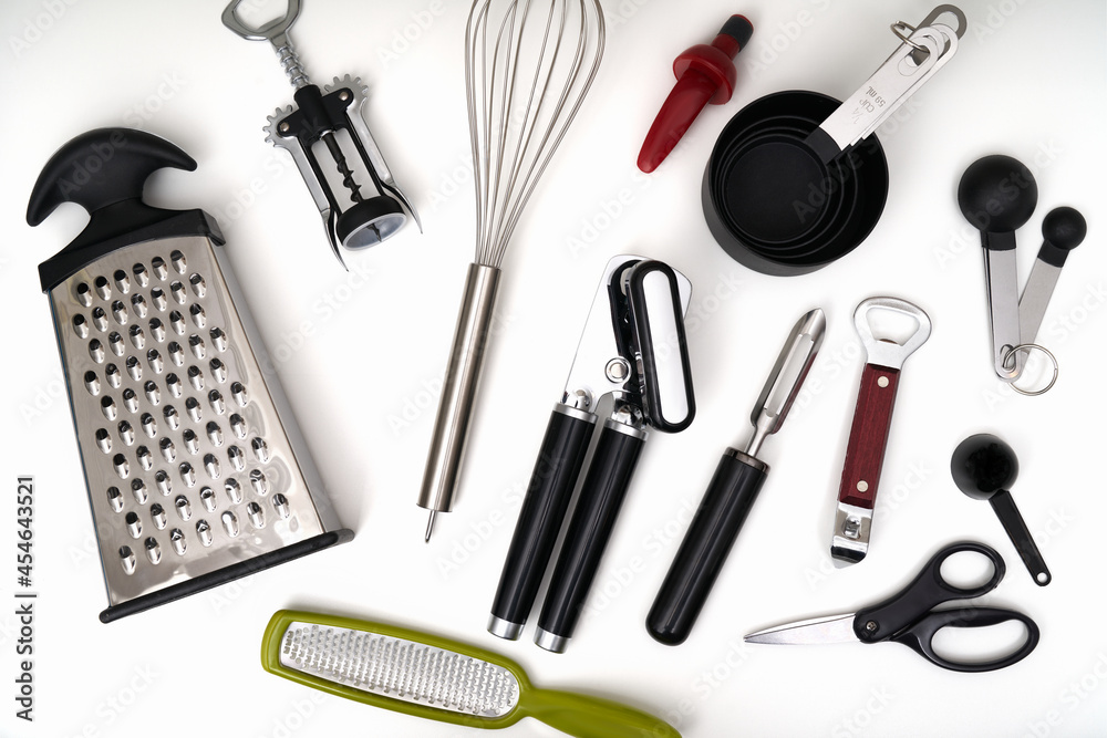 Photograph of a kitchen drawer filled with an assortment of kitchen utensils