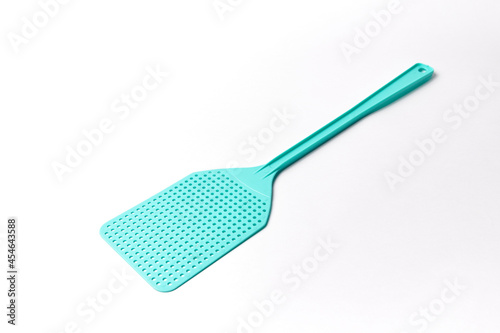 Plastic fly swatter isolated on white, plastic object used to kill a mosquito or any other bug. Also calles fly killer or pest control tool	
