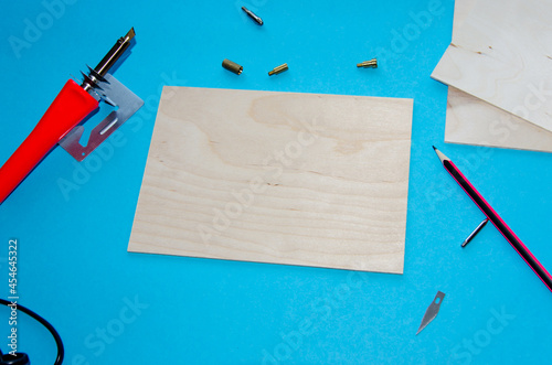 A pyrography tool on a blue background.selective focus photo