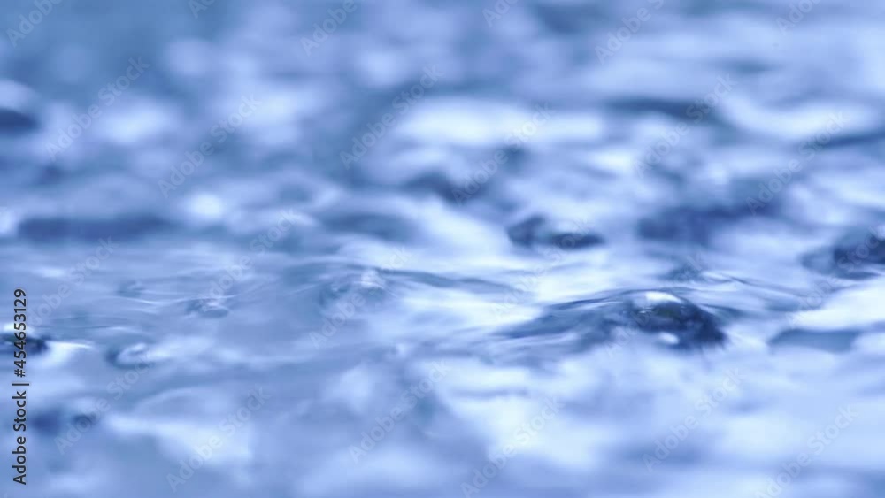 close-up Water bubbling or boiling in clear glass. on a black background. close-up Water bubbling or boiling in clear glass. on a black background.