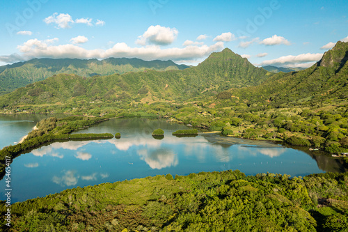 Fotografie Aerial view of the ancient Moli'i fishponds with reflections of the Koolau mountains in the ponds
