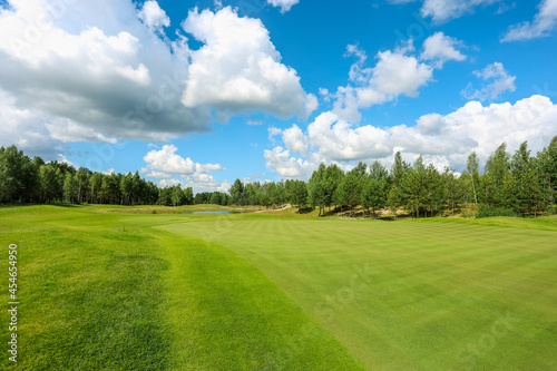 Panorama view of a Golf Course with fairway field. Golf course with a rich green turf beautiful scenery. High quality photo © areporter