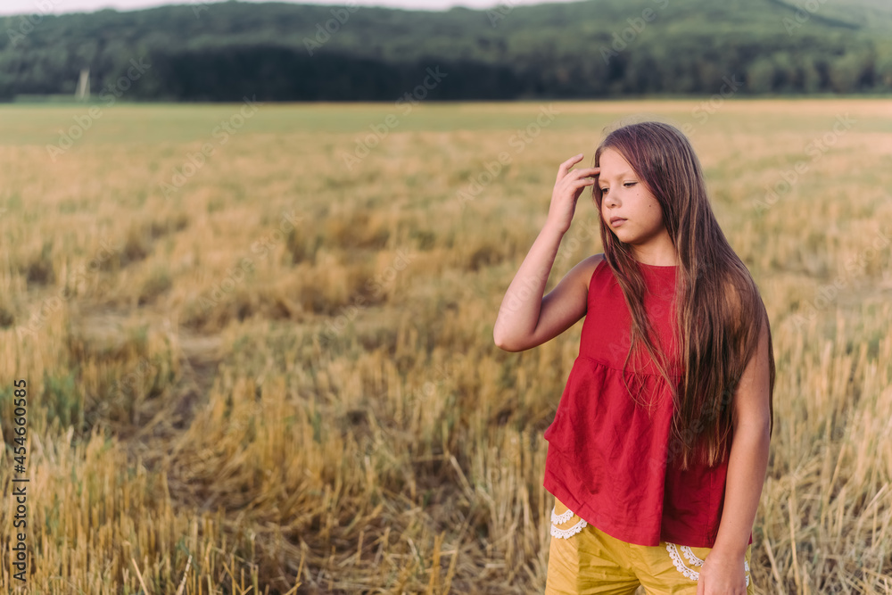 Side view portrait of happy beautiful girl breathing fresh air in field, outdoors. High quality photo Side view portrait of happy beautiful girl breathing fresh air in field, outdoors. High quality photo