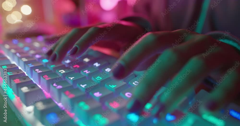 teenage girl hands typing on keyboard gamer girl playing online game