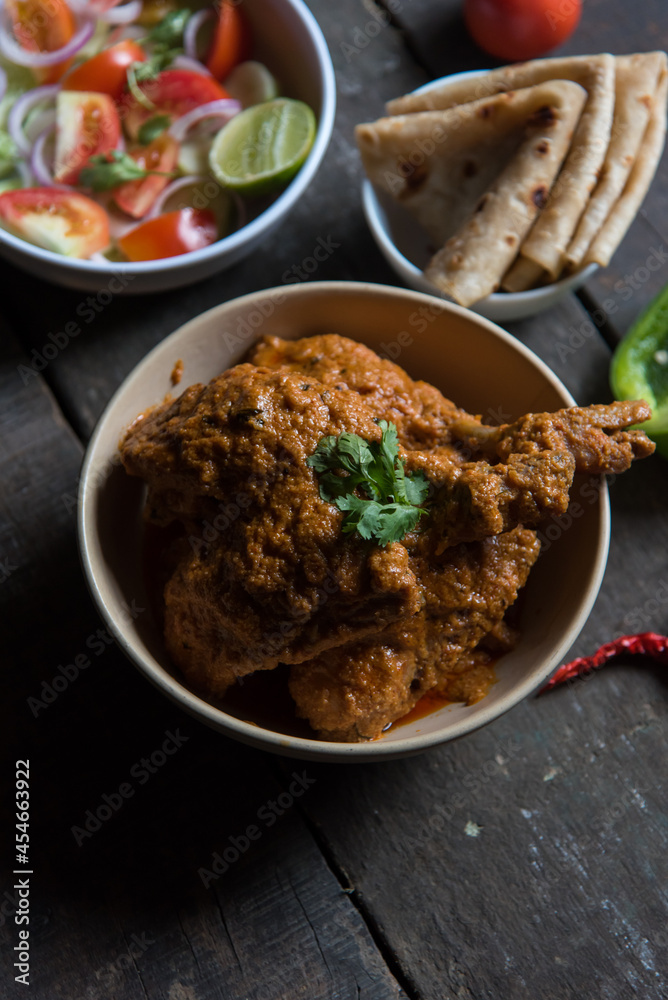 North Indian delicacy murg makhani or butter chicken prepared with chicken breast, onion, garlic and whole Indian spices in a bowl.
North Indian delicacy murg makhani or butter chicken prepared with chicken breast, onion, garlic and whole Indian spices in a bowl.