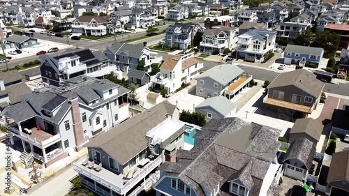 Drone Flying Over Empty Street And Modern Houses In Avalon City During COVID-19 Pandemic In Cape May County, New Jersey. - aerial photo