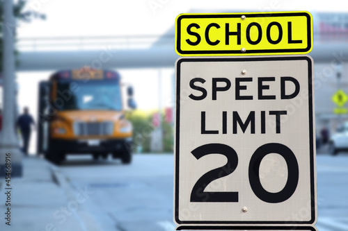 Traffic sign.  School zone  yellow warning board. Speed limit 20