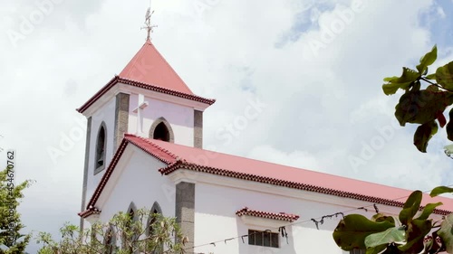 A closeup of the tower of Motael Church in the capital Dili, Timor Leste, Southeast Asia photo