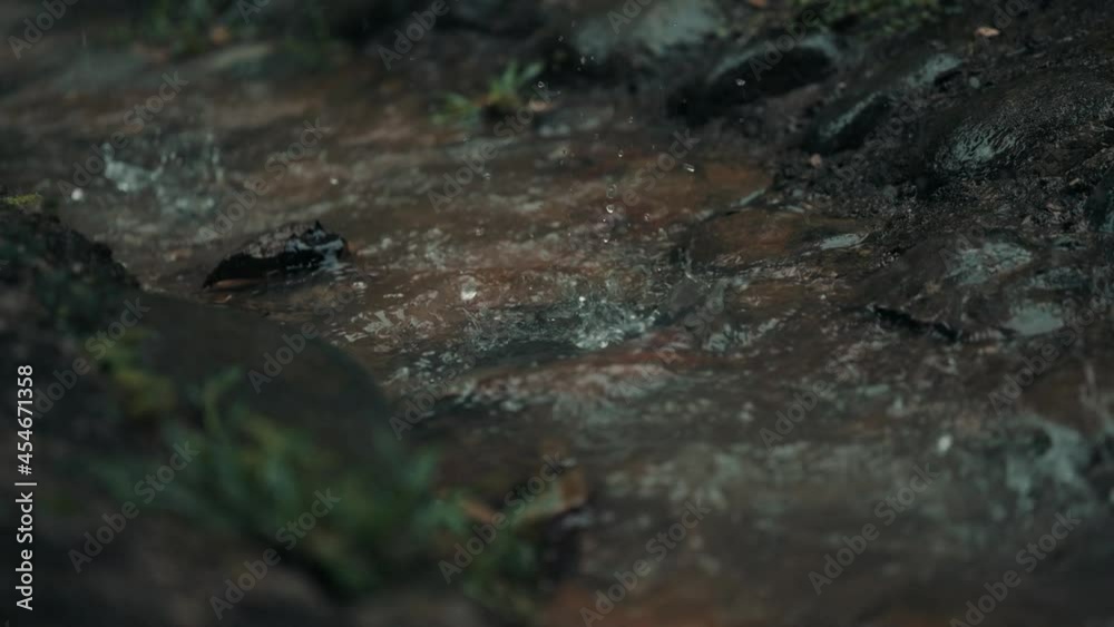 Rain Water Flows And Splashing On The Rocks On Rainy Day In Forest Near Costa Rica. - Closeup Rain Water Flows And Splashing On The Rocks On Rainy Day In Forest Near Costa Rica. - Closeup