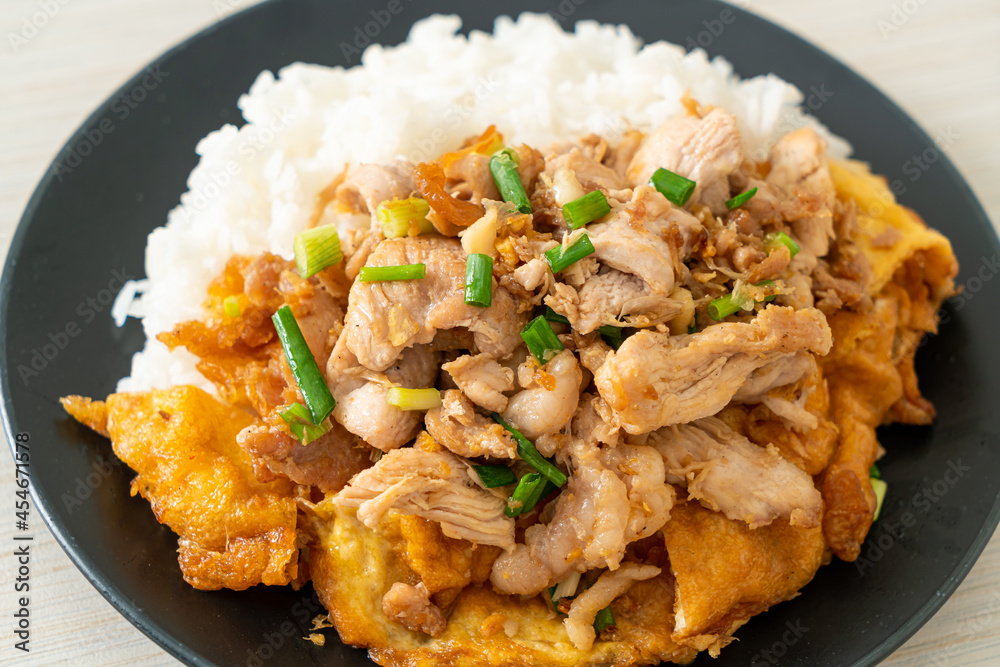 stir-fried pork with garlic and egg topped on rice stir-fried pork with garlic and egg topped on rice