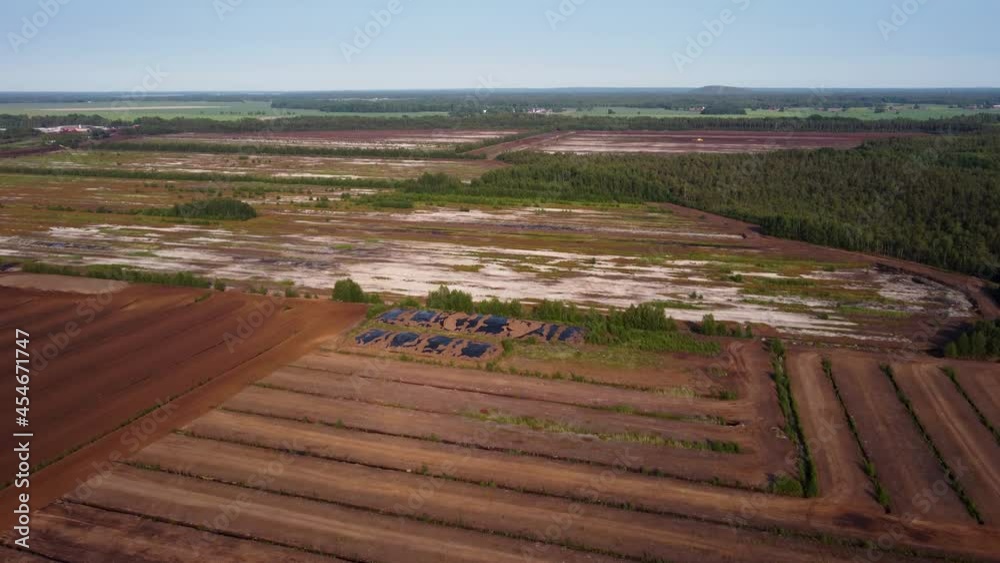 Wide forward aerial of crop fields and forest in rural Sweden Wide forward aerial of crop fields and forest in rural Sweden