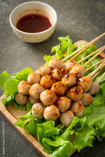 grilled meatballs skewer with spicy sauce