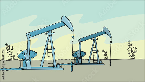Oil pumps and rigs at large oilfield over