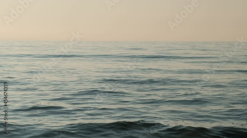 Wallpaper Mural Slow motion of sea waves in soft, warm light, background Torontodigital.ca