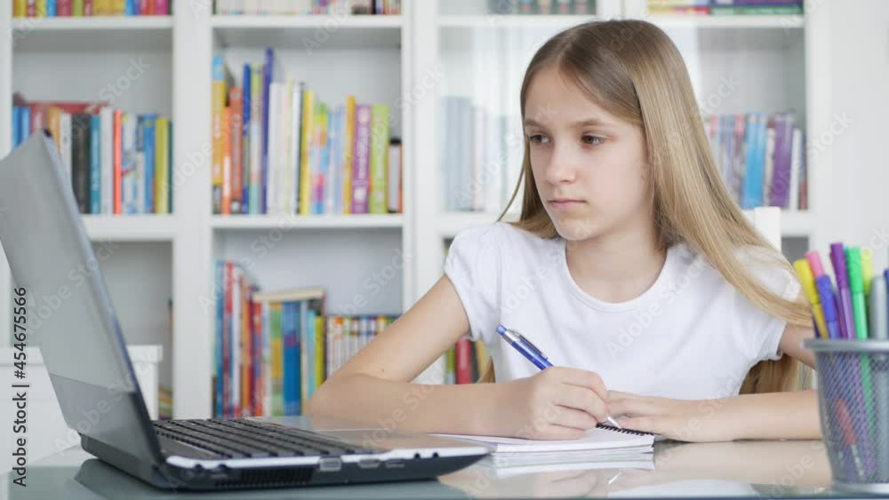 Kid Studying on Laptop in Coronavirus Pandemic, Child Learning, Writing Home, Schoolgirl Teenager Homeschooling, Online Education Kid Studying on Laptop in Coronavirus Pandemic, Child Learning, Writing Home, Schoolgirl Teenager Homeschooling, Online Education