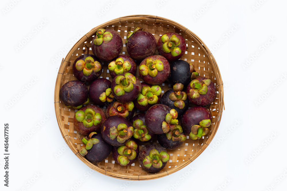 Mangosteen in bamboo basket on white background. Mangosteen in bamboo basket on white background.