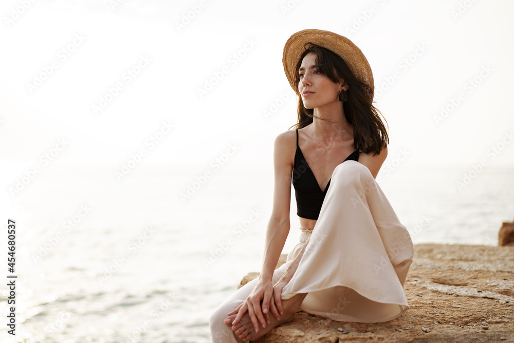 Young smiling woman outdoors portrait at beach Young smiling woman outdoors portrait at beach