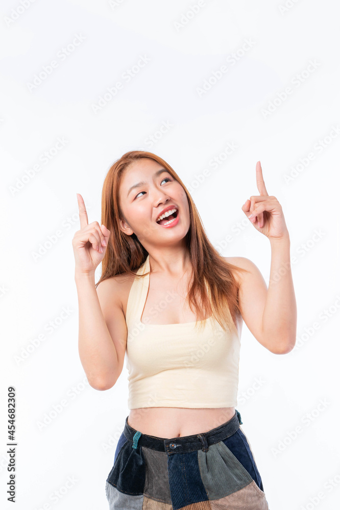 beautiful cute Asian woman smiling and pointing finger to empty copy space , blank space for advertising isolated on white background beautiful cute Asian woman smiling and pointing finger to empty copy space , blank space for advertising isolated on white background