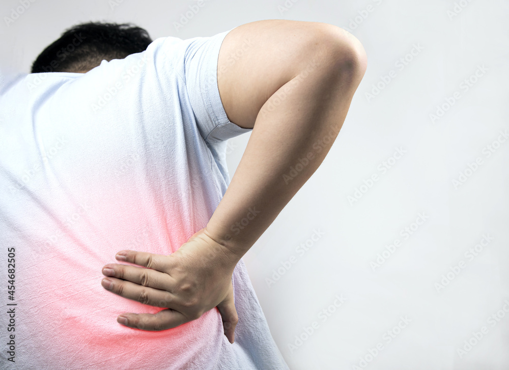 muscle pain, back pain lower back, muscle weakness office syndrome red inflamed zone Man with back pain on gray background. concept of Health care 