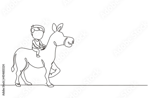 Continuous one line drawing happy cute boy riding cute donkey. Child sitting on back donkey with saddle in ranch park. Kids learning to ride donkey. Single line draw design vector graphic illustration